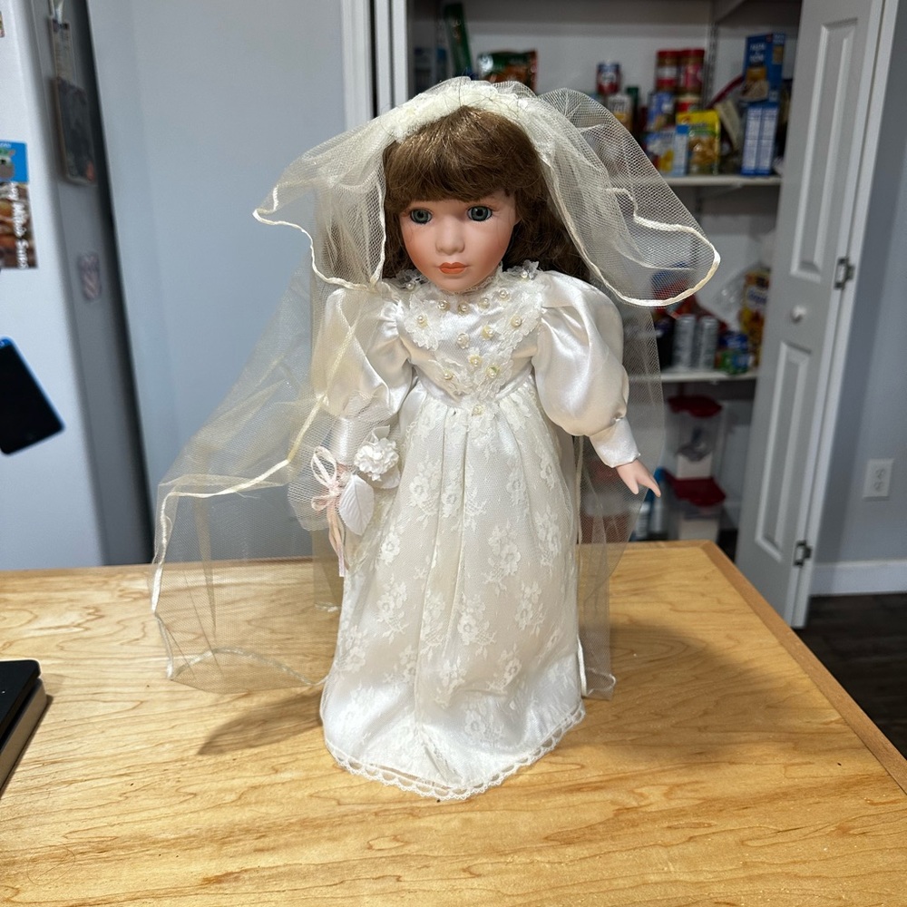 Brown Haired Porcelain Doll